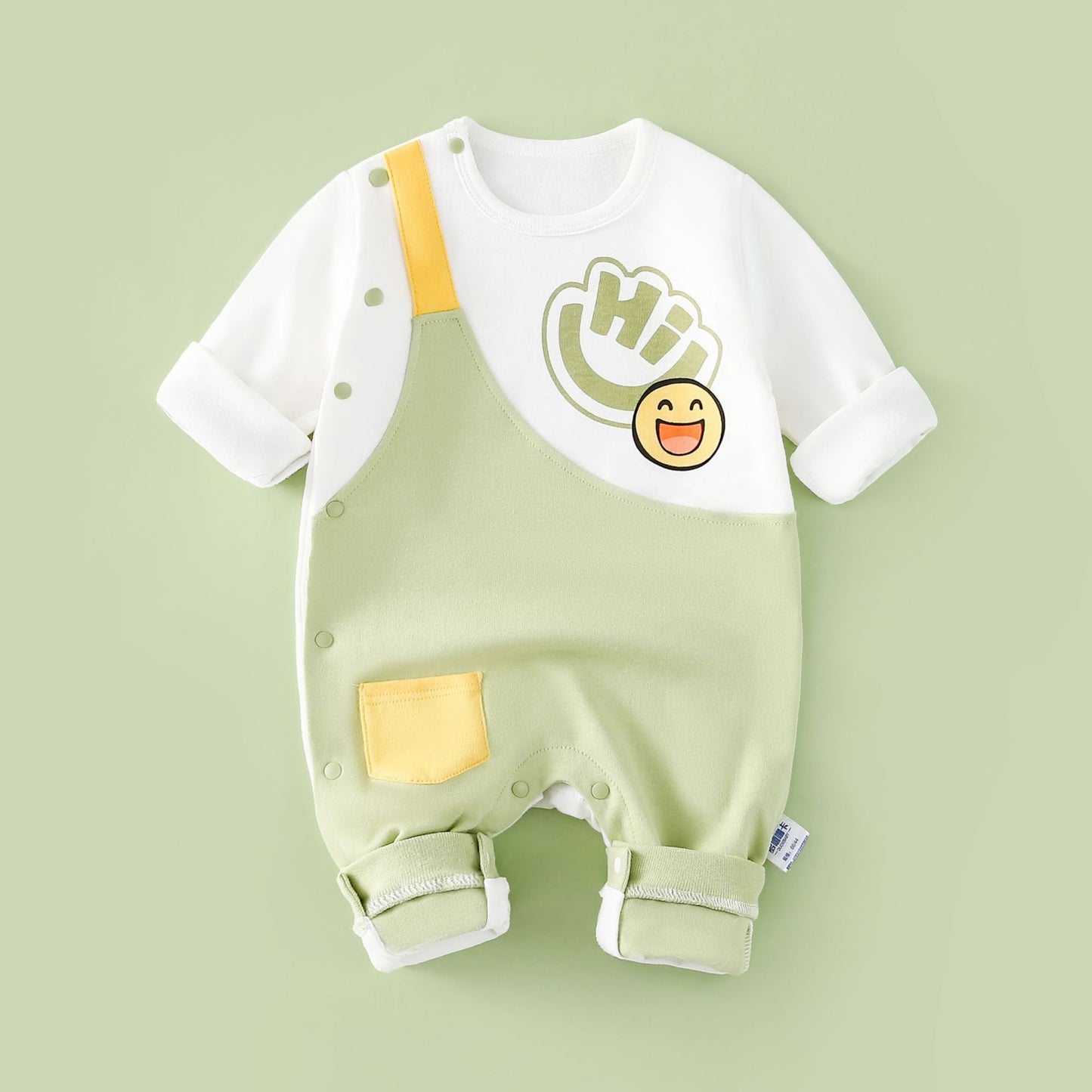 Green smiling long sleeved jumpsuit