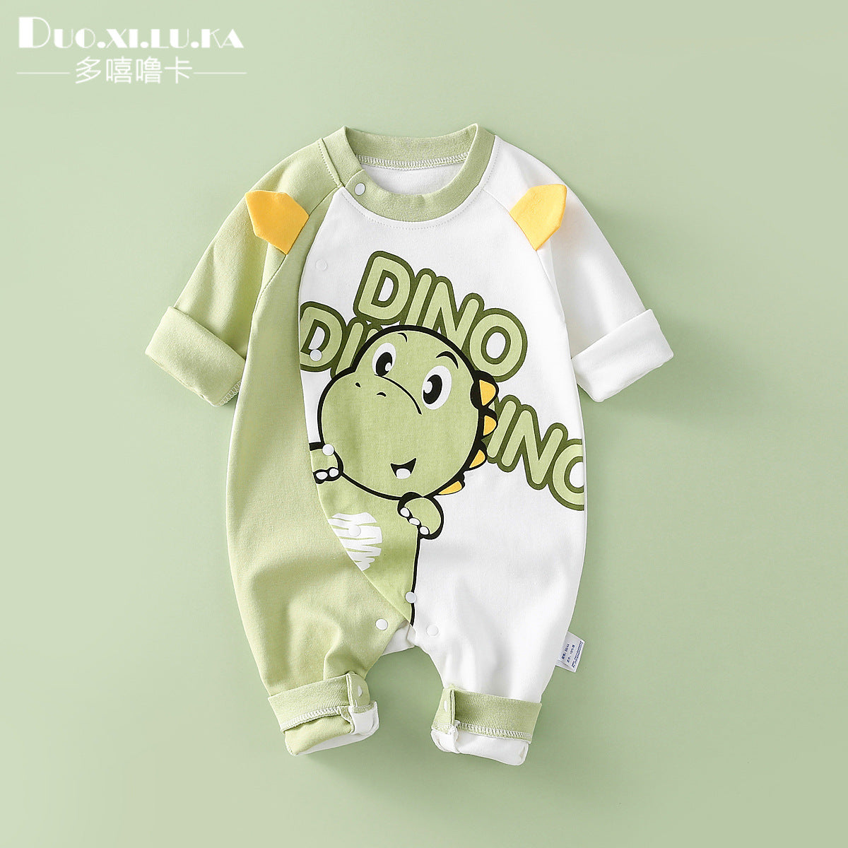 Green dinosaur long sleeved jumpsuit